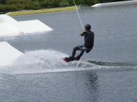 a man on a surfboard in the water at Chez Laurent et Sandrine in Chantraine