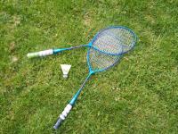 a blue tennis racket laying on the grass at Chez Laurent et Sandrine in Chantraine