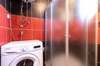 a washer and dryer in a small bathroom at Lucija in Lovinac