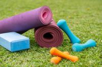 a pink yoga mat and some toys on the grass at Deerpark Luxury Stays in Nairobi