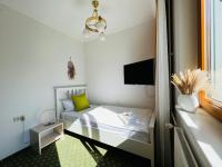 A bed or beds in a room at Dorfpension Mariahilfberg