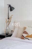 Posteľ alebo postele v izbe v ubytovaní Koti Rentals - Sandy Beach Apartment