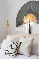 Posteľ alebo postele v izbe v ubytovaní Koti Rentals - Sandy Beach Apartment