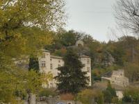 an old stone building on a hill with trees at Gîte Amour D&#39;ardèche in Saint-Sernin