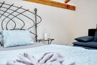 Postel nebo postele na pokoji v ubytování Apartmány Svatošské skály