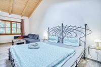 Postel nebo postele na pokoji v ubytování Apartmány Svatošské skály