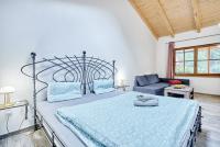 Postel nebo postele na pokoji v ubytování Apartmány Svatošské skály