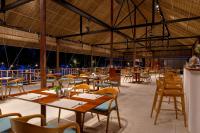 a restaurant with tables and chairs and a large ceiling at ISLAND CENTER POINT in Koh Rong Sanloem