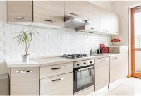 A kitchen or kitchenette at Appartamento Milano