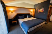 Postel nebo postele na pokoji v ubytování Roof 264 Hotel & Suites