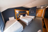 Postel nebo postele na pokoji v ubytování Roof 264 Hotel & Suites