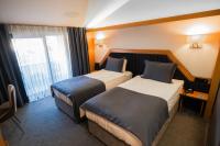 Postel nebo postele na pokoji v ubytování Roof 264 Hotel & Suites