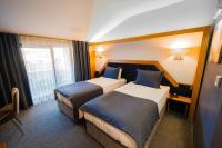 Postel nebo postele na pokoji v ubytování Roof 264 Hotel & Suites