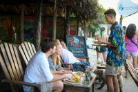 a group of people sitting at a table eating food at Finca Escondida in Palomino