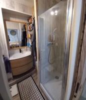 a bathroom with a shower and a sink at Petit appartement T2 30m2 in Aix-les-Bains