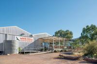 a metal building with a sign that reads wool shed restoration at Rawnsley Park Station in Flinders Ranges