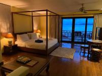 Postel nebo postele na pokoji v ubytování Cinnamon Beach Villas