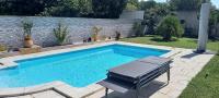 a swimming pool in a yard with at Studio in Sorgues