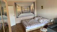 Łóżko lub łóżka w pokoju w obiekcie Sweet-home erkélyes apartman Kaposvár