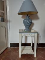 a table with a lamp on top of it at La Quiétude in Cotignac