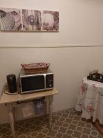 a microwave sitting on a table in a room at La Quiétude in Cotignac