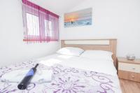Posteľ alebo postele v izbe v ubytovaní Apartman Lara