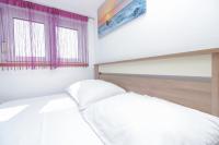 Posteľ alebo postele v izbe v ubytovaní Apartman Lara