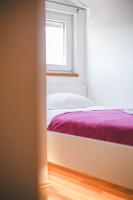 Posteľ alebo postele v izbe v ubytovaní Apartman Lara