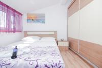 Posteľ alebo postele v izbe v ubytovaní Apartman Lara