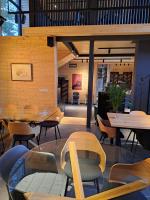 a restaurant with tables and chairs in a room at Saint Constantine Mountain Retreat in Peshtera
