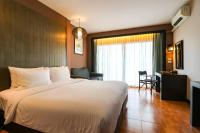 Postel nebo postele na pokoji v ubytování Royal View Resort - Rang Nam