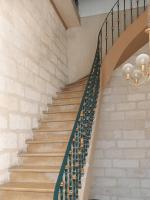 a staircase with a bunch of wine bottles at Cosy Green - WIFI HD - NETFLIX GRATUIT in Avignon