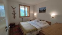 Łóżko lub łóżka w pokoju w obiekcie Chalet Le Refuge