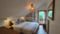 Łóżko lub łóżka w pokoju w obiekcie Chalet Le Refuge