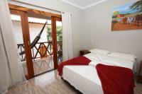 Cama ou camas em um quarto em Pousada e Restaurante Paraíso Natural
