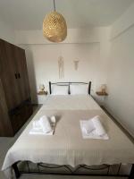 A bed or beds in a room at Olivar Suites