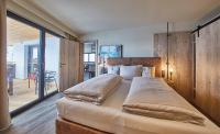 Posteľ alebo postele v izbe v ubytovaní THOMSN Central Hotel & Appartements