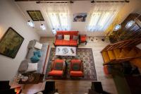 an overhead view of a living room with orange furniture at Svjetlost in Jahorina