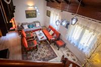 an overhead view of a living room with orange furniture at Svjetlost in Jahorina