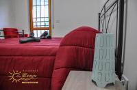Łóżko lub łóżka w pokoju w obiekcie Residence Sunbeam