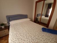 A bed or beds in a room at Casa Porto, con Garaje
