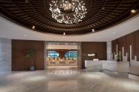 a lobby of a hotel with a chandelier at White Swan Hotel Taizhou in Taizhou
