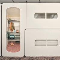 an open door to a room with a closet at CityHub Amsterdam in Amsterdam