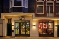a store front of a city hub at night at CityHub Amsterdam in Amsterdam