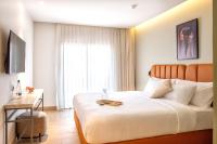 Ein Bett oder Betten in einem Zimmer der Unterkunft Hotel Shoshana - Adults Only