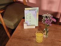a vase of flowers and a box on a table at CityHub Amsterdam in Amsterdam