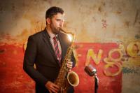 a man in a suit playing a saxophone at Roxy Hotel New York in New York