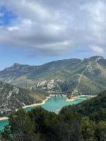 a view of a lake in the mountains at Moli l&#39;Abad in Puebla de Benifasar