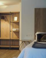 a bedroom with a bed and a book shelf at Moli l&#39;Abad in Puebla de Benifasar