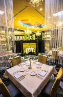 a dining room with a table and chairs at Walker's Bluff Casino Resort in Carbondale